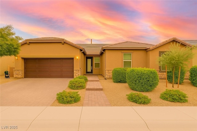 5616 Silver Cascade Ave, Las Vegas, NV 89131 - single story home with stone siding, driveway, a garage, stucco siding, and a tile roof
