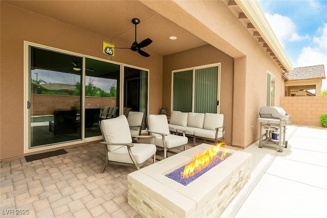 5616 Silver Cascade Ave, Las Vegas, NV 89131 - view of patio / terrace featuring a grill, ceiling fan, and an outdoor living space with a fire pit