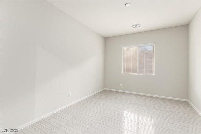 5616 Silver Cascade Ave, Las Vegas, NV 89131 - spare room with baseboards and light tile patterned floors