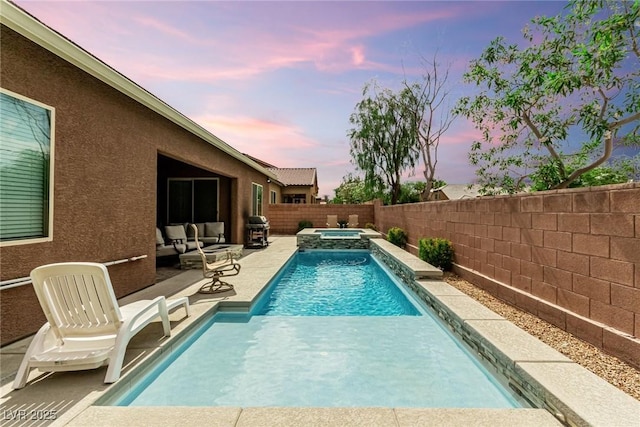 5616 Silver Cascade Ave, Las Vegas, NV 89131 - pool at dusk featuring a grill, an in-ground hot tub, a patio, and a fenced backyard