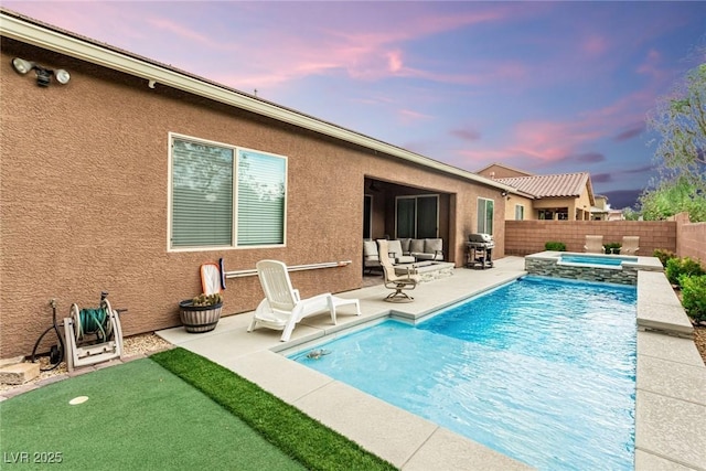 5616 Silver Cascade Ave, Las Vegas, NV 89131 - view of swimming pool with a patio, area for grilling, a fenced backyard, a pool with connected hot tub, and an outdoor hangout area