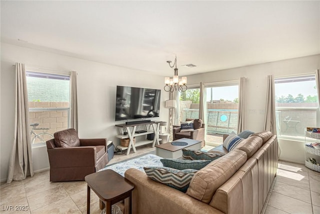 9690 Langden Brook St, Las Vegas, NV 89178 - living room featuring a chandelier and light tile patterned flooring
