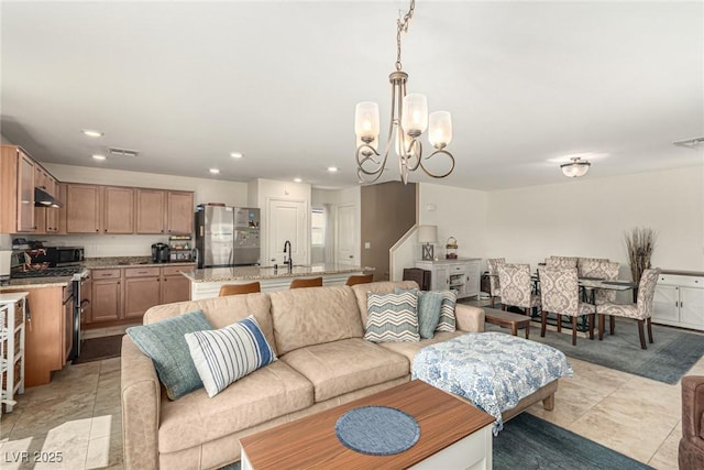 9690 Langden Brook St, Las Vegas, NV 89178 - living area with a chandelier and recessed lighting