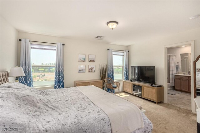 9690 Langden Brook St, Las Vegas, NV 89178 - bedroom featuring light carpet and ensuite bath