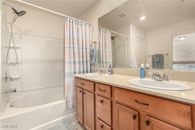 9690 Langden Brook St, Las Vegas, NV 89178 - full bathroom featuring shower / bath combo with shower curtain and double vanity