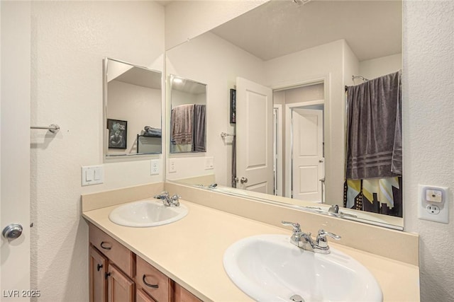 9690 Langden Brook St, Las Vegas, NV 89178 - bathroom with a textured wall and double vanity