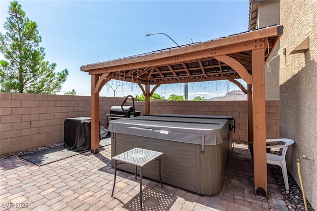 9690 Langden Brook St, Las Vegas, NV 89178 - fenced backyard with a hot tub, a gazebo, and a patio