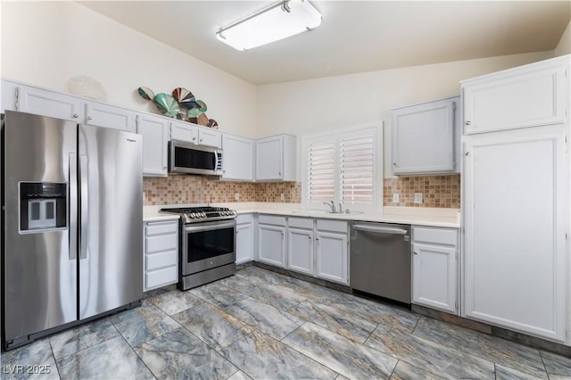 1740 Leaning Pine Way, Las Vegas, NV 89128 - kitchen with appliances with stainless steel finishes, a sink, light countertops, and backsplash