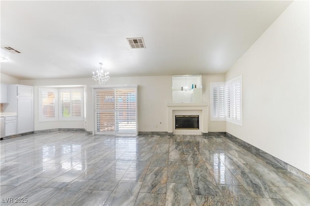 1740 Leaning Pine Way, Las Vegas, NV 89128 - unfurnished living room featuring light marble finish floors, a chandelier, and a fireplace