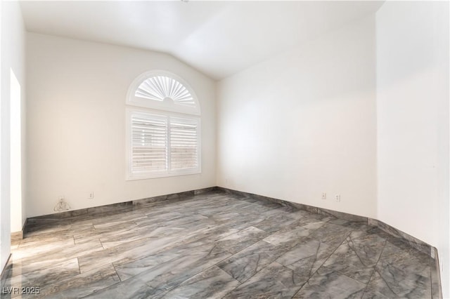 1740 Leaning Pine Way, Las Vegas, NV 89128 - spare room with vaulted ceiling and marble look tiles
