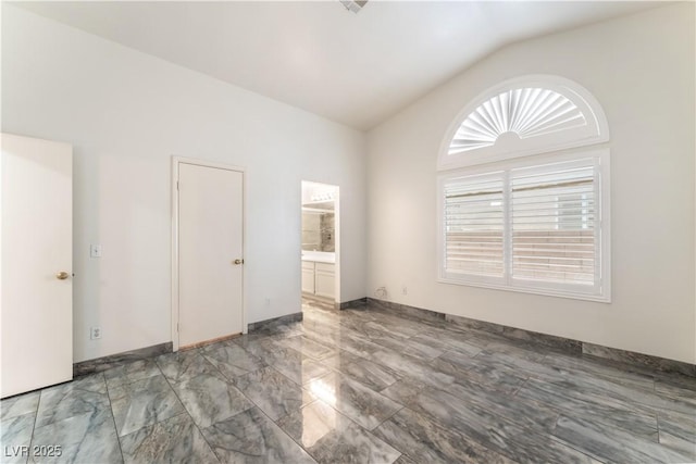 1740 Leaning Pine Way, Las Vegas, NV 89128 - unfurnished bedroom featuring lofted ceiling and light marble finish flooring