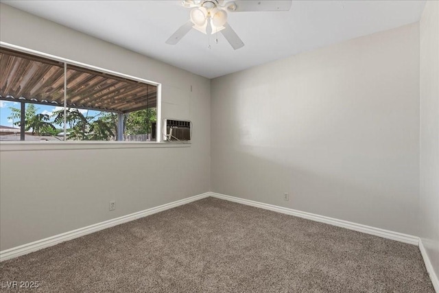 808 Reynolds Ave, North Las Vegas, NV 89030 - unfurnished room featuring carpet, a ceiling fan, baseboards, and an AC wall unit