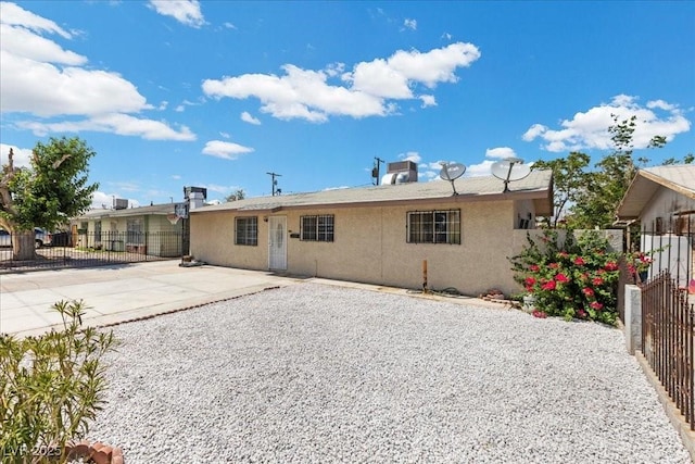 808 Reynolds Ave, North Las Vegas, NV 89030 - rear view of house featuring stucco siding and a patio