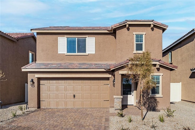 4245 Gold Desert St, North Las Vegas, NV 89032 - traditional-style home featuring a garage, decorative driveway, and stucco siding