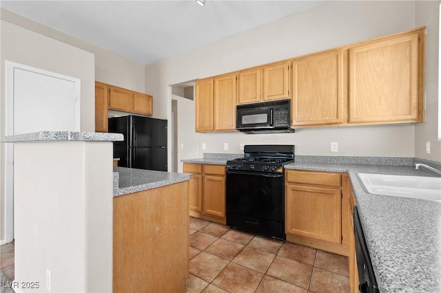 5307 Wild Orchid St, North Las Vegas, NV 89031 - kitchen with black appliances, a sink, light countertops, light tile patterned floors, and light brown cabinets