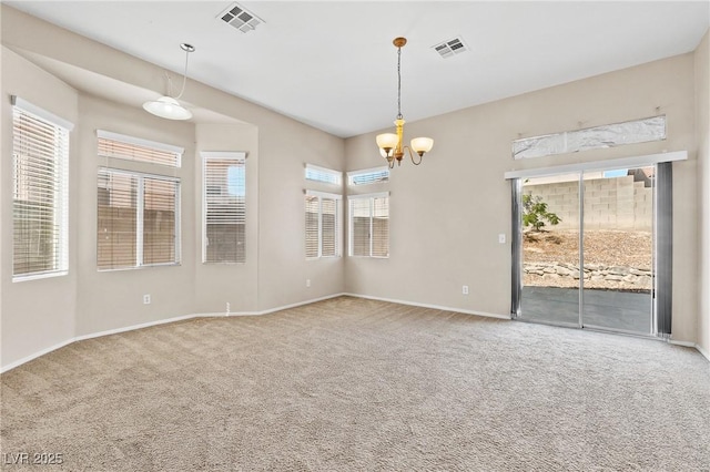 5307 Wild Orchid St, North Las Vegas, NV 89031 - empty room with carpet floors, baseboards, and a chandelier