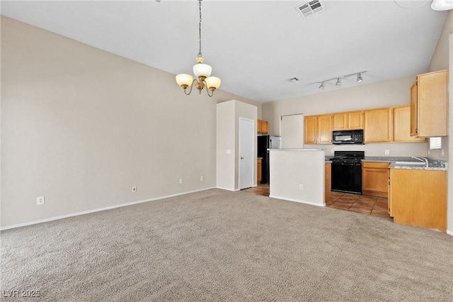 5307 Wild Orchid St, North Las Vegas, NV 89031 - kitchen featuring black appliances, light colored carpet, a chandelier, open floor plan, and light countertops