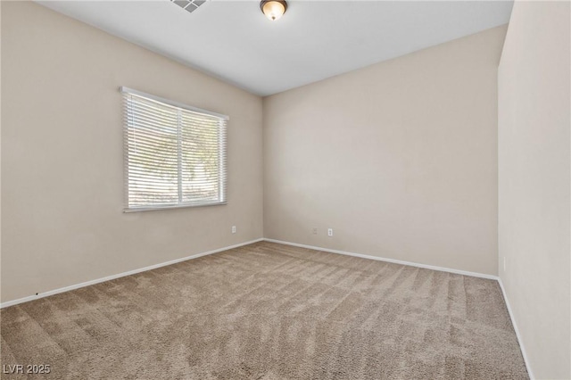 5307 Wild Orchid St, North Las Vegas, NV 89031 - carpeted spare room with baseboards