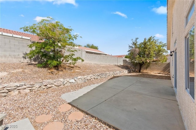 5307 Wild Orchid St, North Las Vegas, NV 89031 - fenced backyard featuring a patio
