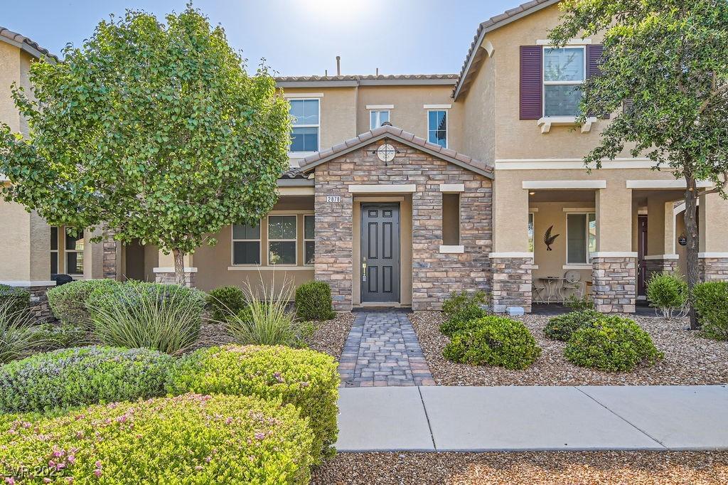 2878 Via Firenze, Henderson, NV 89044 - view of front of home featuring stone siding, stucco siding, and a tile roof