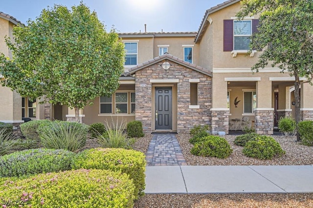 2878 Via Firenze, Henderson, NV 89044 - view of front of home featuring stone siding, stucco siding, and a tile roof