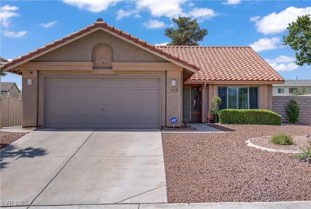 1219 Heather Oaks Way N, Las Vegas, NV 89031 - view of front of property featuring a tiled roof, an attached garage, driveway, and stucco siding