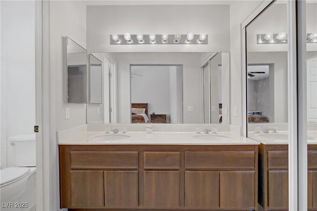 1219 Heather Oaks Way N, Las Vegas, NV 89031 - bathroom with ensuite bath, double vanity, and toilet