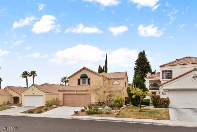 3217 Harbor Vista St, Las Vegas, NV 89117 - view of front of house featuring concrete driveway, stucco siding, a garage, and a tiled roof