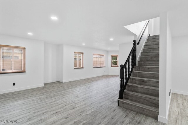 3217 Harbor Vista St, Las Vegas, NV 89117 - unfurnished living room with stairway, recessed lighting, light wood-style floors, and baseboards