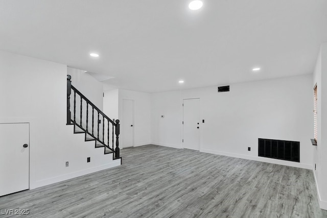 3217 Harbor Vista St, Las Vegas, NV 89117 - unfurnished living room featuring recessed lighting, wood finished floors, stairs, and baseboards