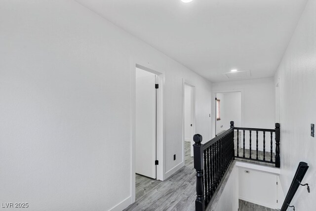 3217 Harbor Vista St, Las Vegas, NV 89117 - corridor with an upstairs landing, light wood-type flooring, attic access, baseboards, and recessed lighting