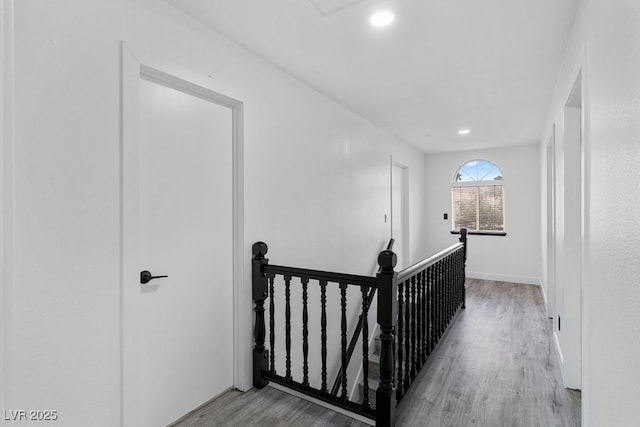 3217 Harbor Vista St, Las Vegas, NV 89117 - hallway with an upstairs landing, wood finished floors, recessed lighting, and baseboards
