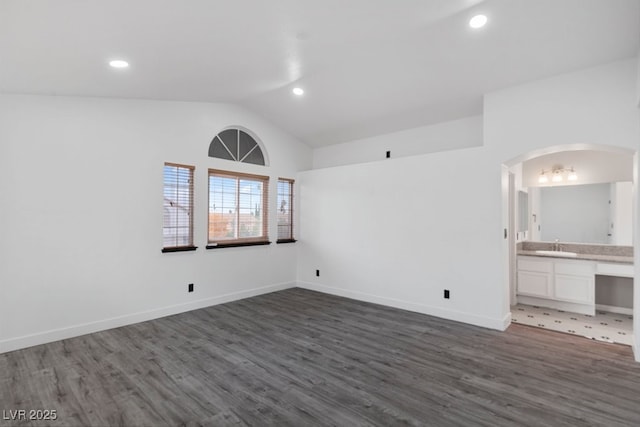 3217 Harbor Vista St, Las Vegas, NV 89117 - spare room with vaulted ceiling, arched walkways, wood finished floors, recessed lighting, and baseboards