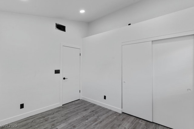 3217 Harbor Vista St, Las Vegas, NV 89117 - unfurnished bedroom featuring wood finished floors, recessed lighting, a closet, and baseboards