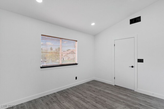3217 Harbor Vista St, Las Vegas, NV 89117 - empty room featuring baseboards, wood finished floors, recessed lighting, and vaulted ceiling