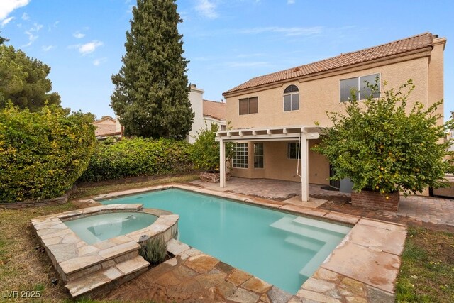 3217 Harbor Vista St, Las Vegas, NV 89117 - rear view of house featuring a tile roof, a patio, stucco siding, and a pool with connected hot tub