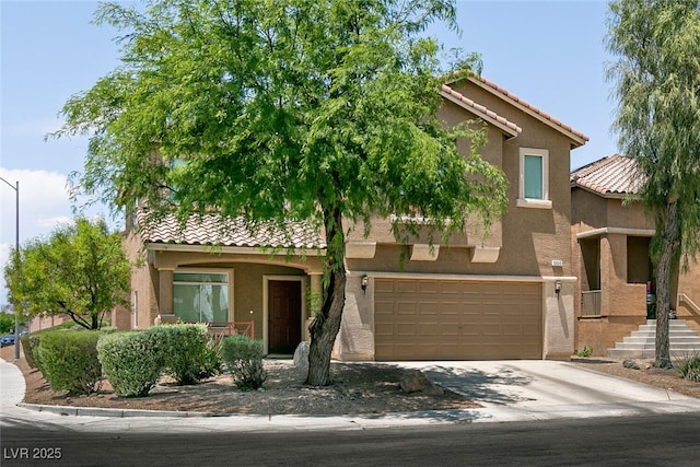 5835 Running Horse Dr, North Las Vegas, NV 89081 - view of front of home featuring a tile roof, stucco siding, driveway, and a garage