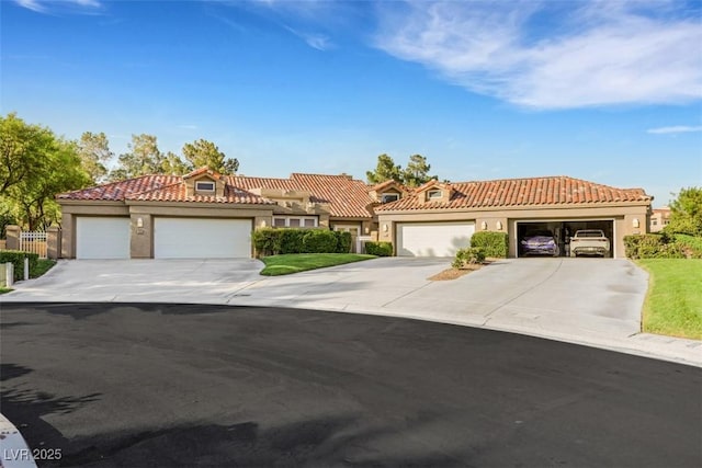 5008 Shoal Creek Cir, Las Vegas, NV 89113 - mediterranean / spanish-style home with driveway, a tile roof, a garage, and stucco siding