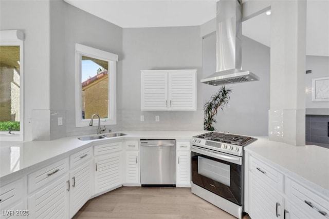 5008 Shoal Creek Cir, Las Vegas, NV 89113 - kitchen with appliances with stainless steel finishes, wall chimney exhaust hood, a sink, and plenty of natural light