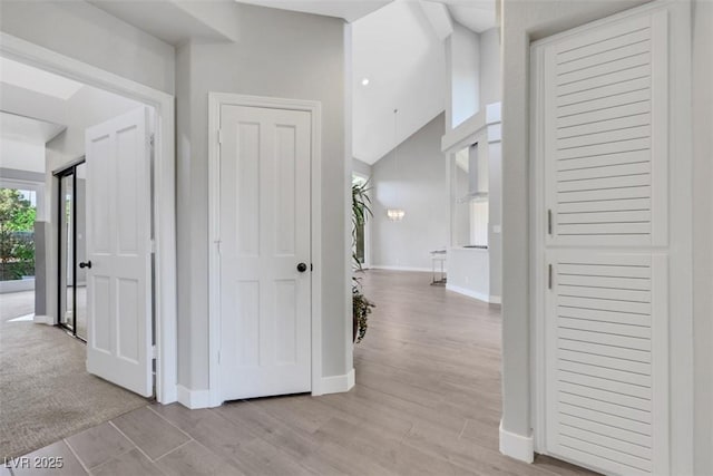 5008 Shoal Creek Cir, Las Vegas, NV 89113 - corridor with baseboards and light wood-style flooring