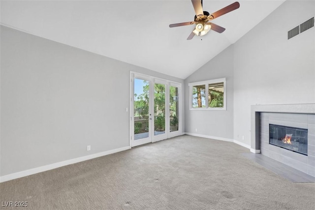 5008 Shoal Creek Cir, Las Vegas, NV 89113 - unfurnished living room with baseboards, high vaulted ceiling, a tile fireplace, carpet, and ceiling fan