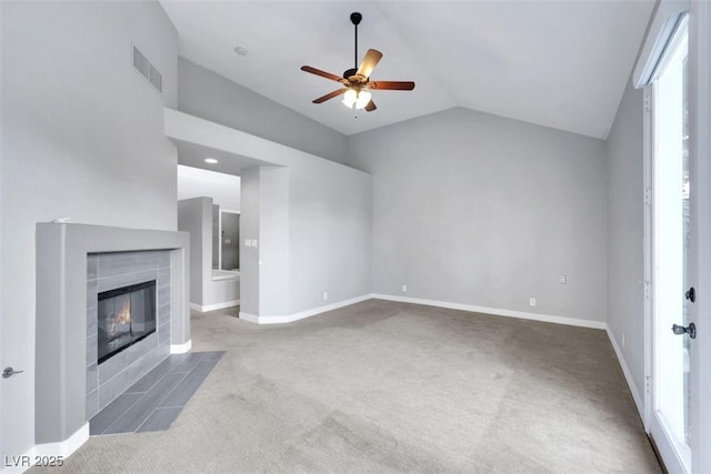 5008 Shoal Creek Cir, Las Vegas, NV 89113 - unfurnished living room featuring carpet flooring, vaulted ceiling, a ceiling fan, a fireplace, and baseboards