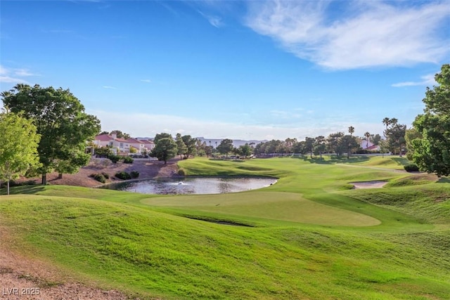 5008 Shoal Creek Cir, Las Vegas, NV 89113 - view of property's community featuring golf course view, a water view, and a lawn