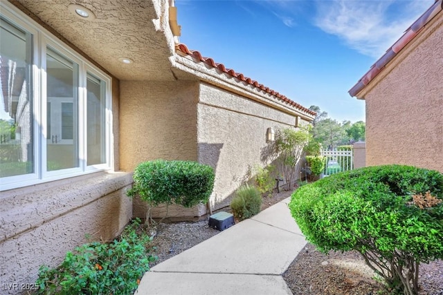 5008 Shoal Creek Cir, Las Vegas, NV 89113 - view of side of home with stucco siding and a tiled roof