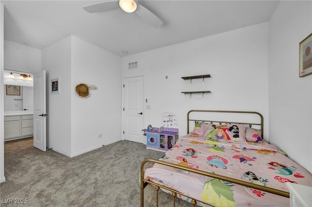 8055 Tank Loop St, Las Vegas, NV 89166 - carpeted bedroom with ensuite bathroom, a ceiling fan, and baseboards