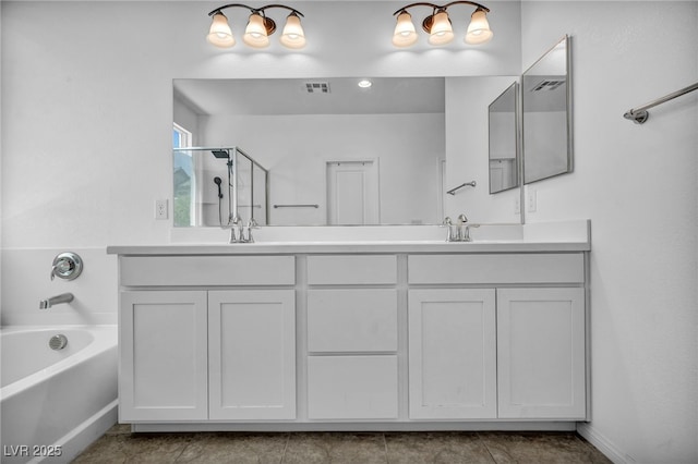 8055 Tank Loop St, Las Vegas, NV 89166 - full bathroom with double vanity, a garden tub, a stall shower, and tile patterned flooring
