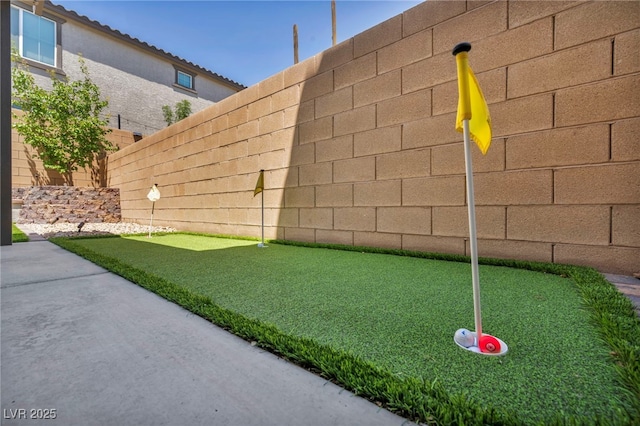 8055 Tank Loop St, Las Vegas, NV 89166 - view of yard with a putting green