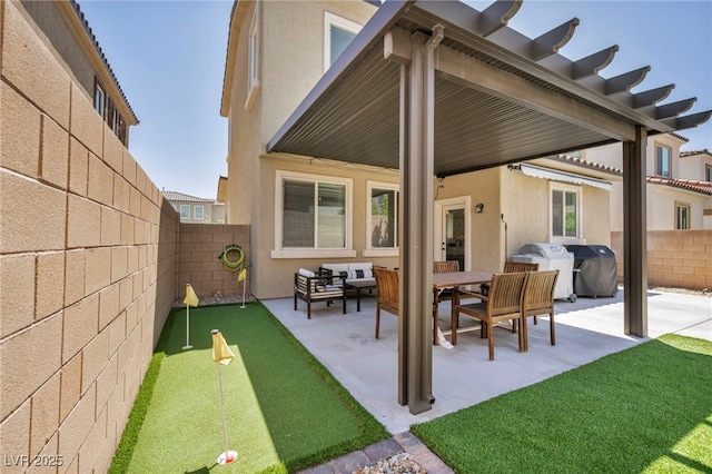 8055 Tank Loop St, Las Vegas, NV 89166 - rear view of house with a putting area, a patio, and a fenced backyard