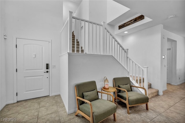 8055 Tank Loop St, Las Vegas, NV 89166 - tiled foyer with stairway, baseboards, and a high ceiling