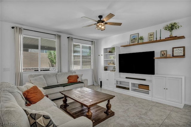 8055 Tank Loop St, Las Vegas, NV 89166 - living room with ceiling fan, light tile patterned floors, and baseboards